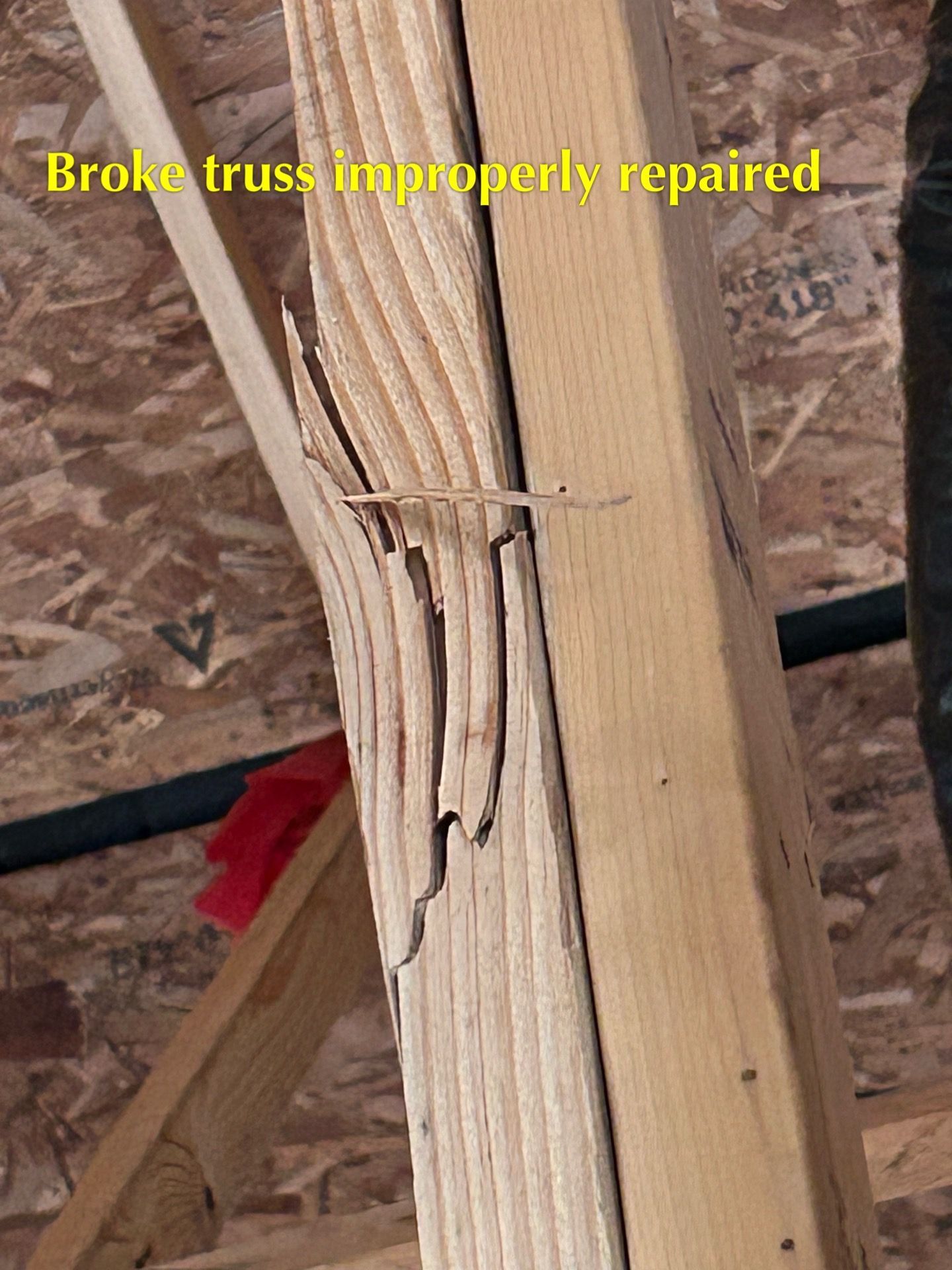 A picture of a broken truss that has been repaired
