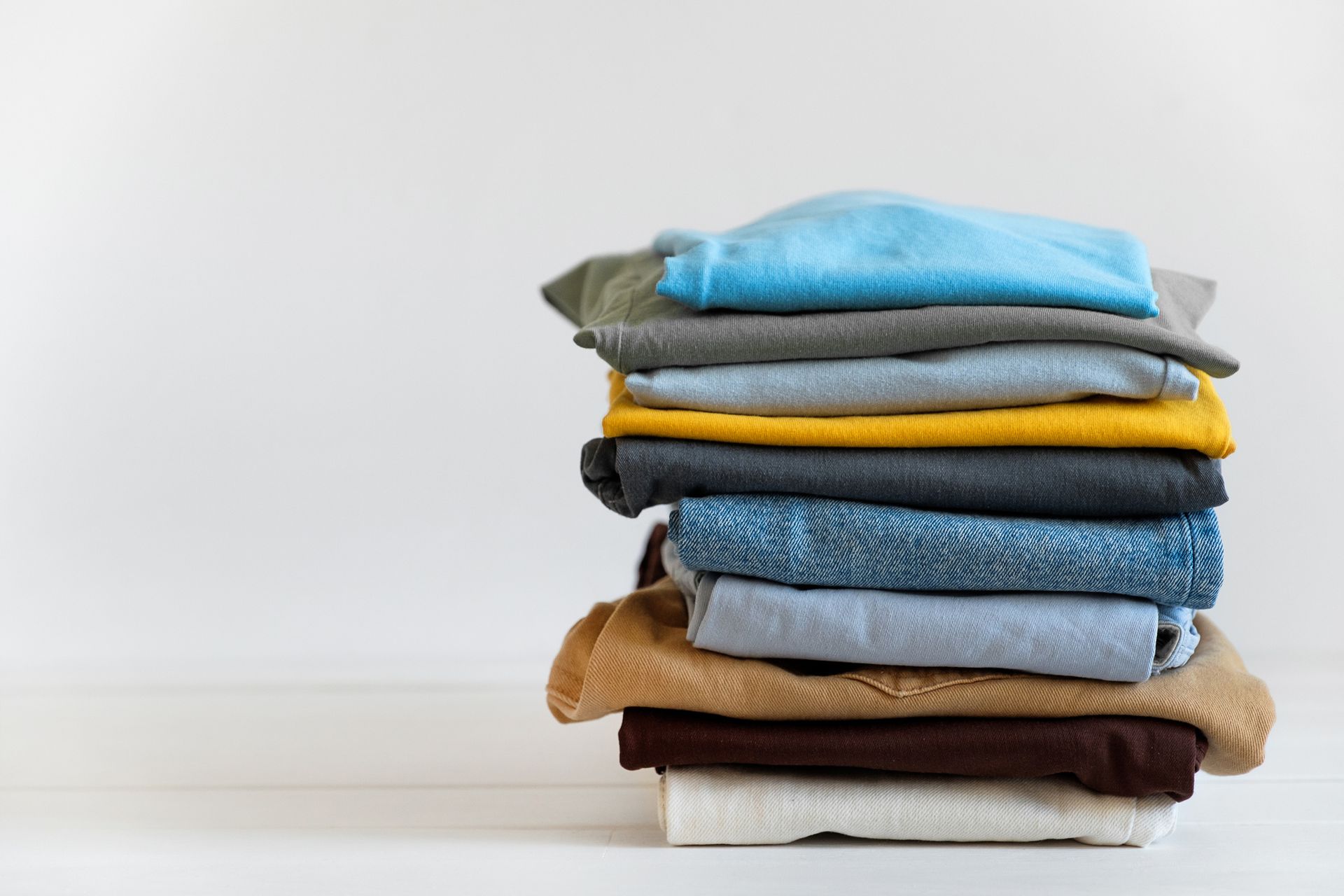 Folded Clothes — Dry Clean Shirts On Hangers in Holyoke, MA