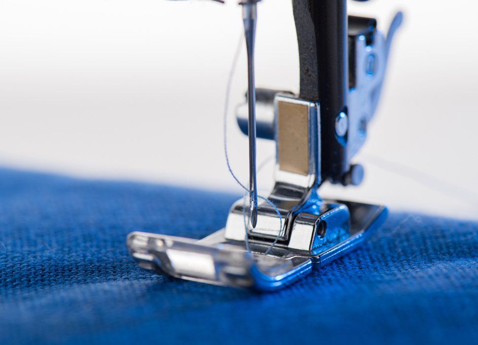 Damaged Clothing Restoration — Repairing Fabric Using Sewing Machine in Holyoke, MA