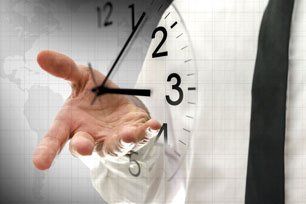 Businessman navigating virtual clock in interface - concept of time
