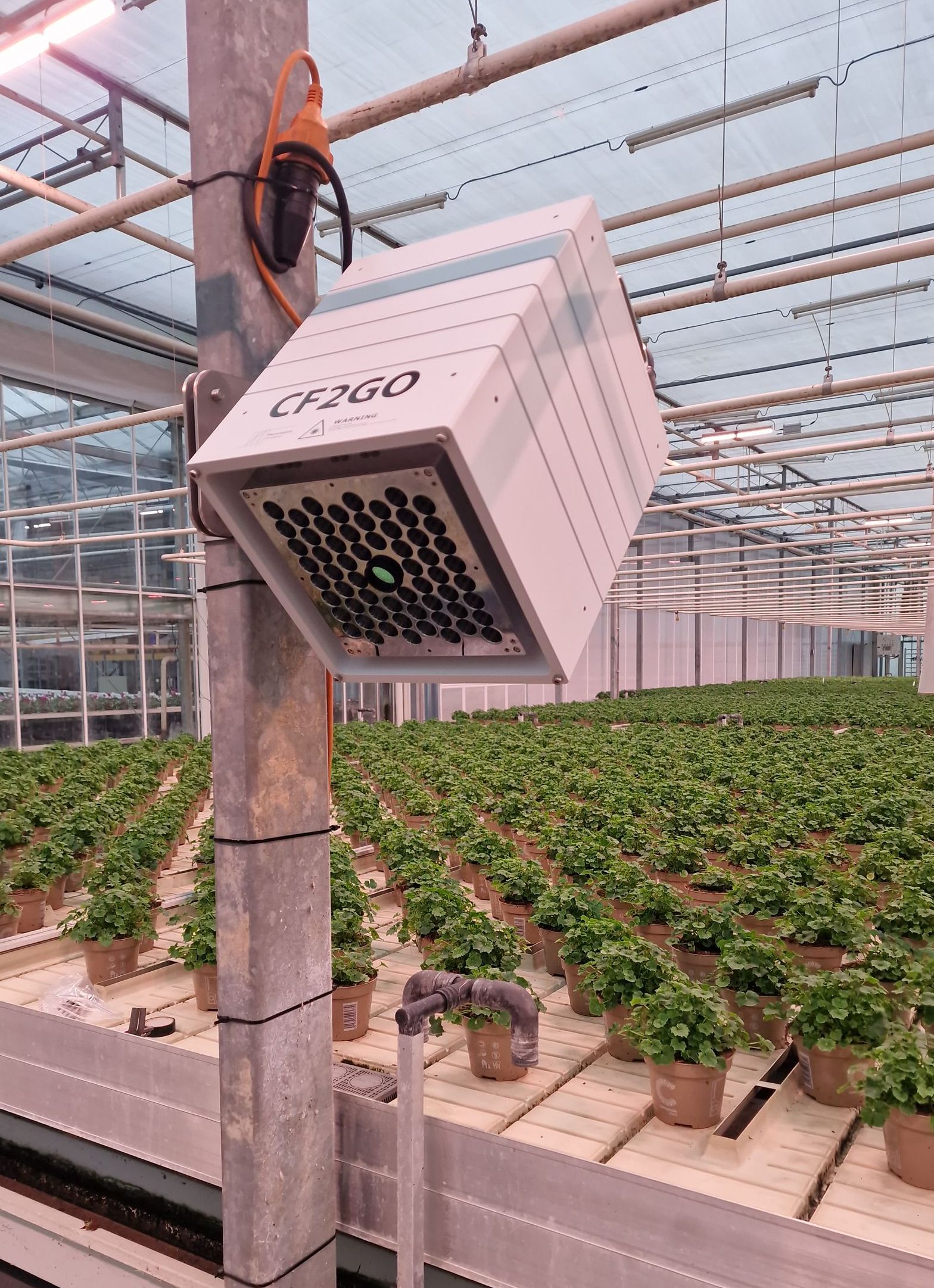 Photosynthesis camera in a greenhouse that is measuring the crop in real time.