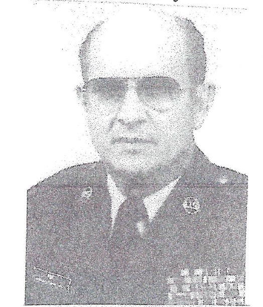 A black and white photo of a man in a military uniform and tie.