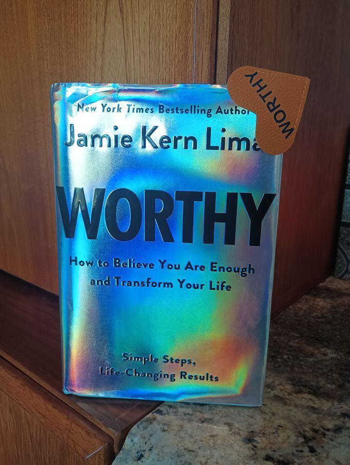 A book titled worthy by jamie kern lime