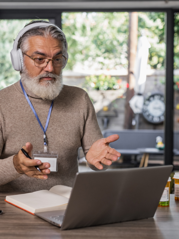 man with headphones on computer