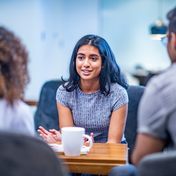 three young women sitting together