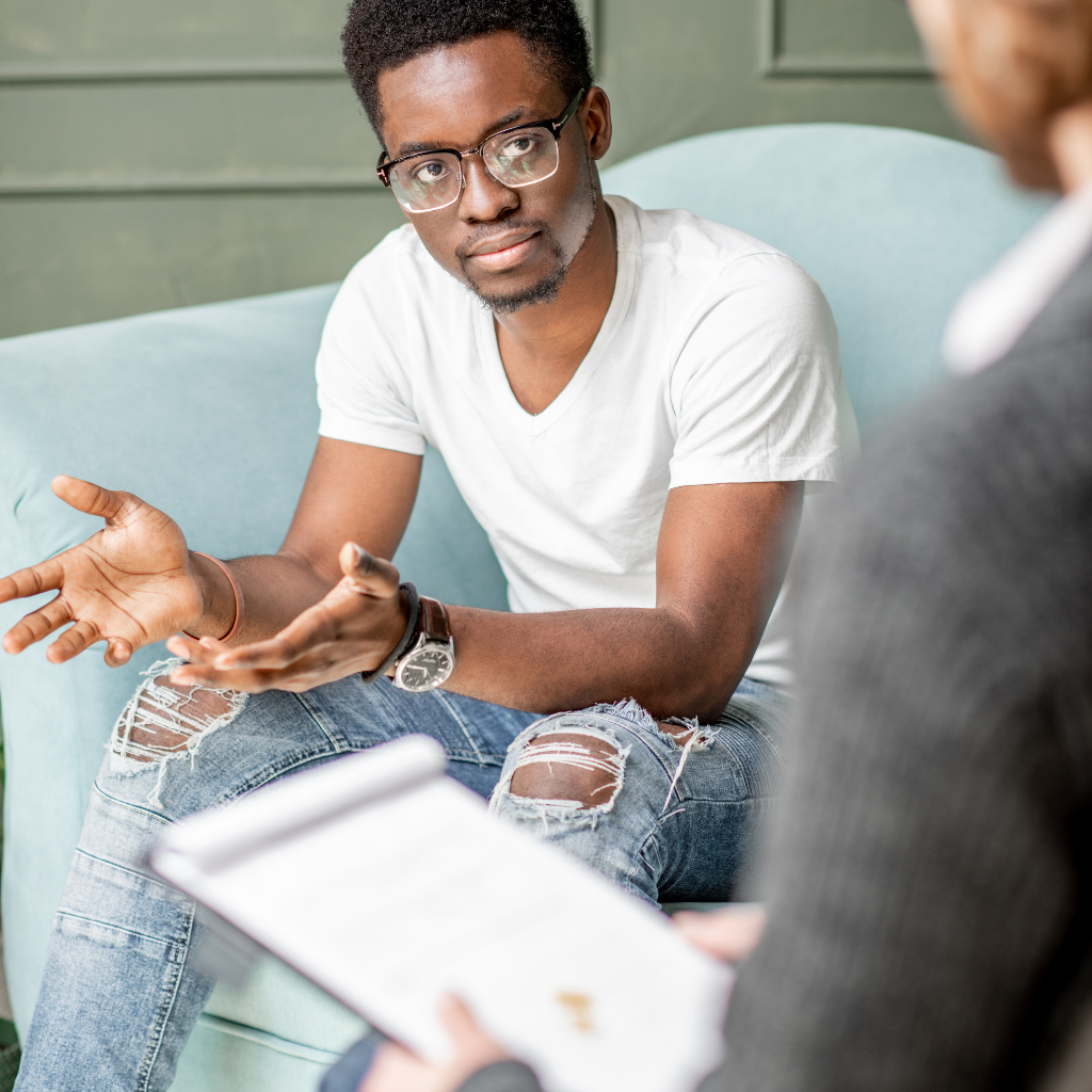man with headphones on computer