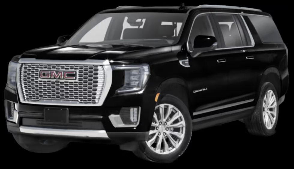 A black gmc yukon is shown on a black background.