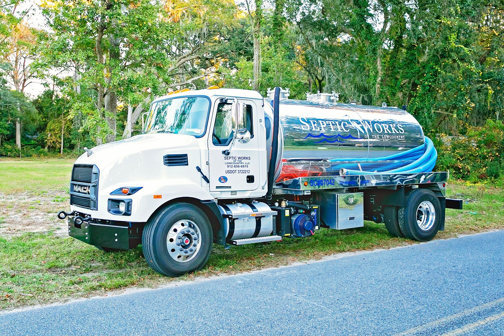 a septic works truck is parked on the side of the road in Wilmington Island, Georgia