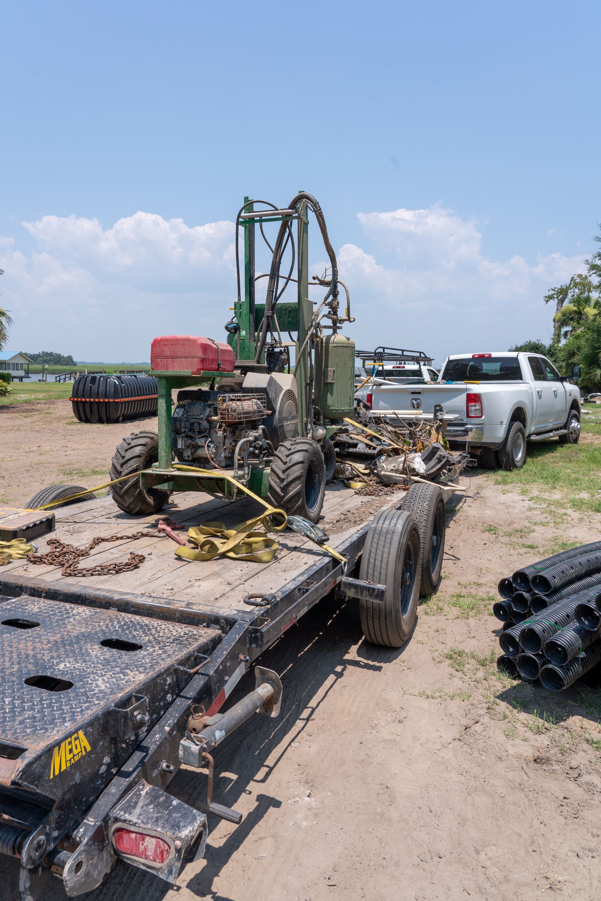 a tractor is on a trailer that says mebk on the side