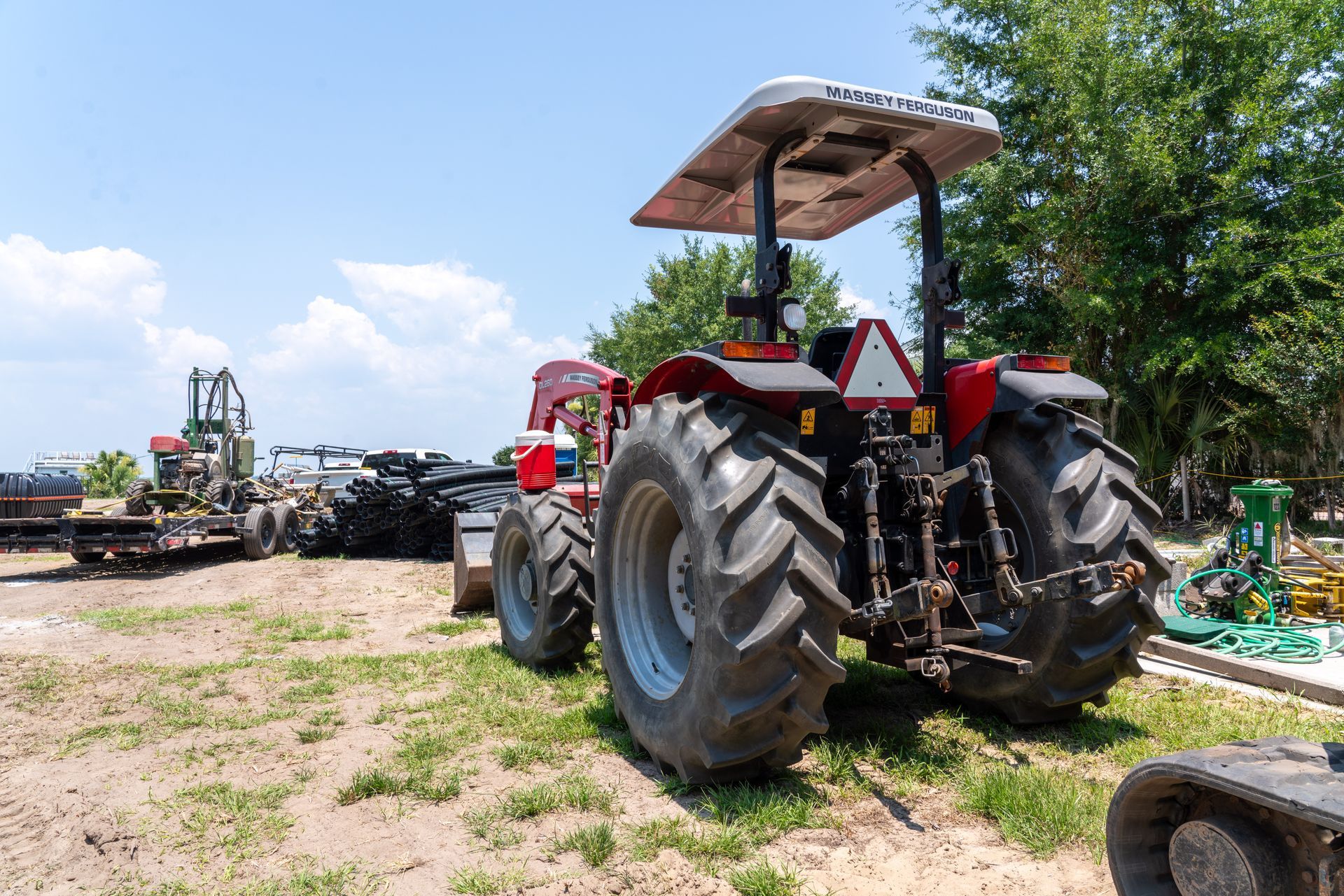 a massey ferguson tractor is parked in a field