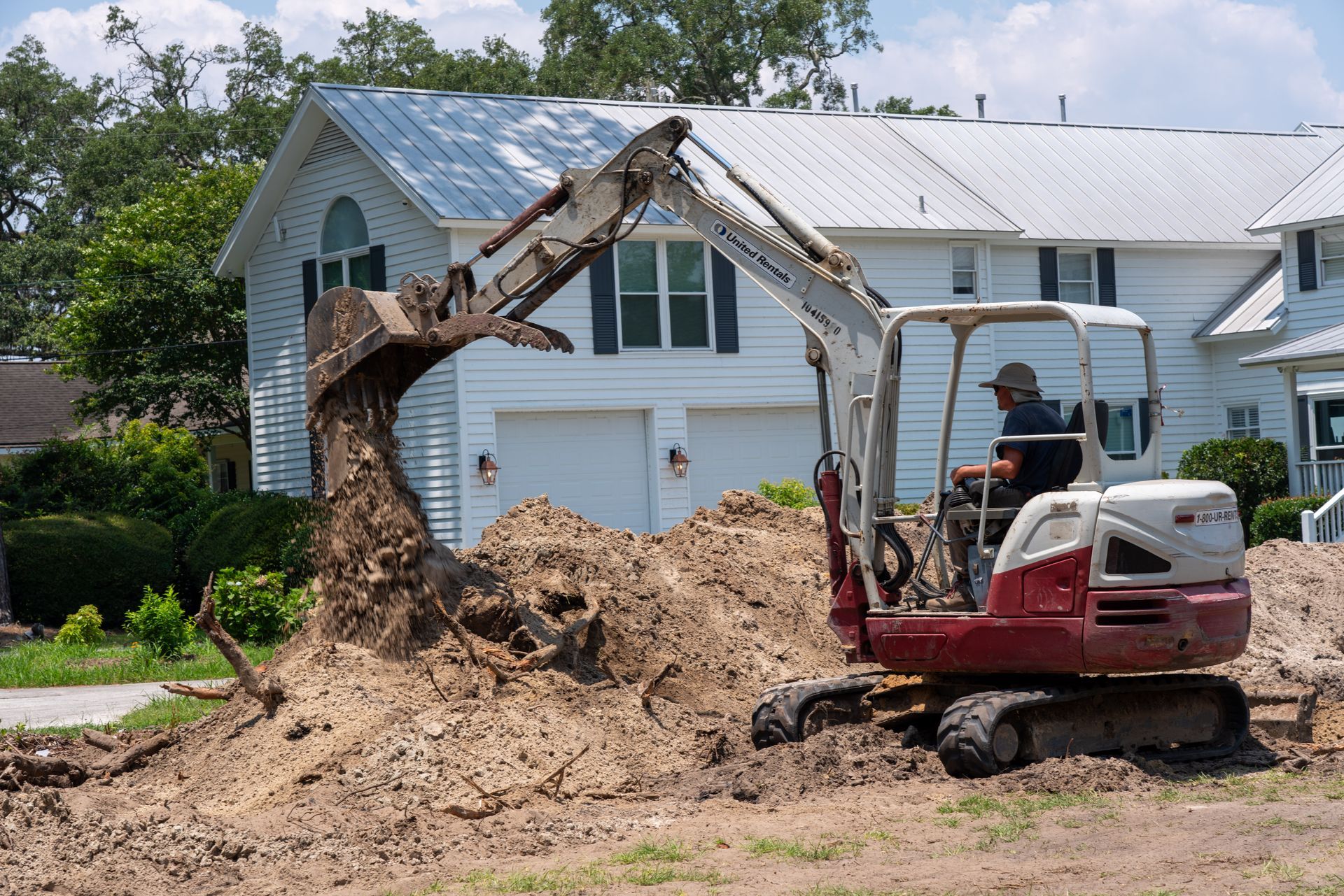 a man is driving an excavator that says tb200 on the front