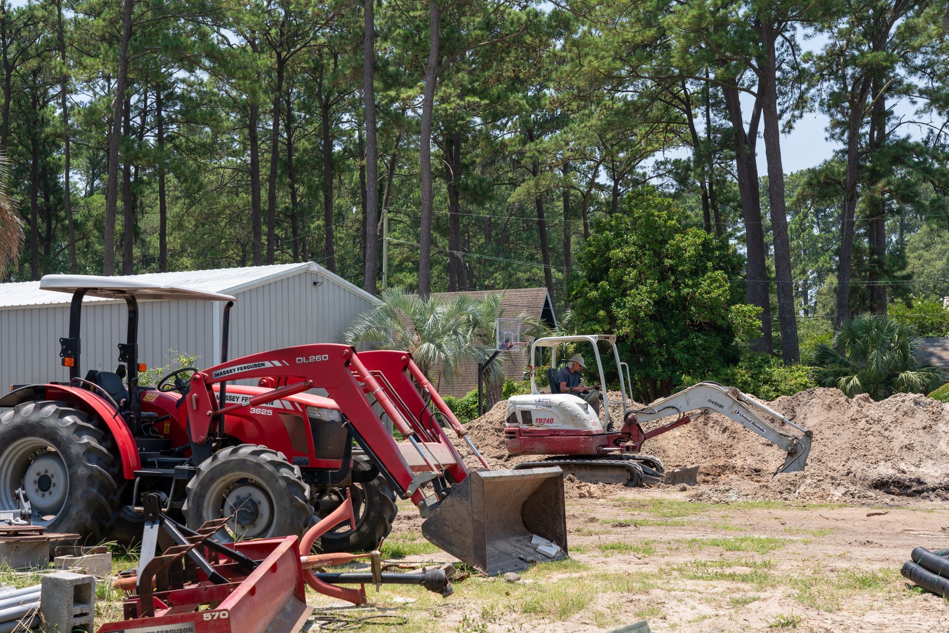 a red massey ferguson tractor is parked in a field