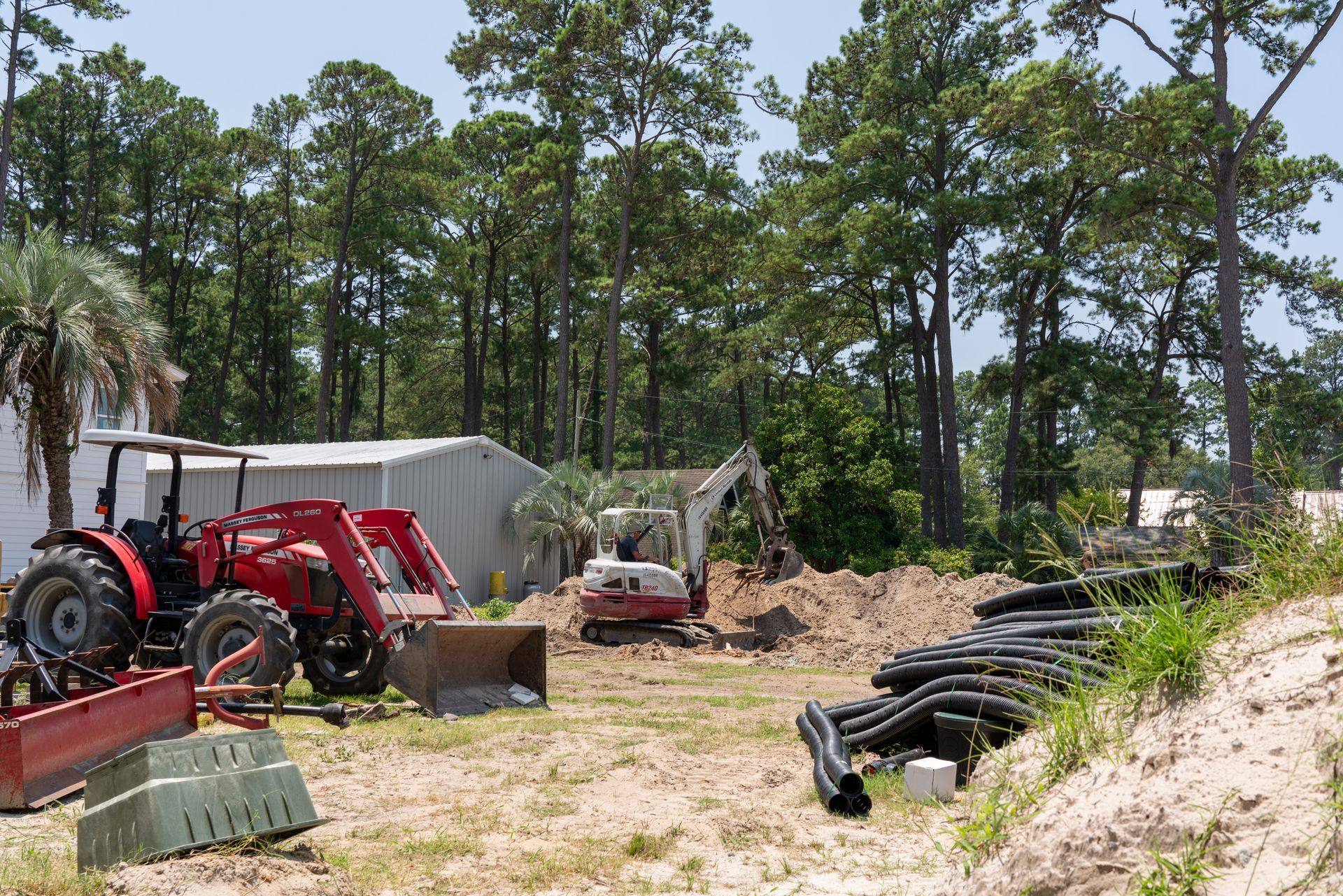 a red massey ferguson tractor is parked in the dirt