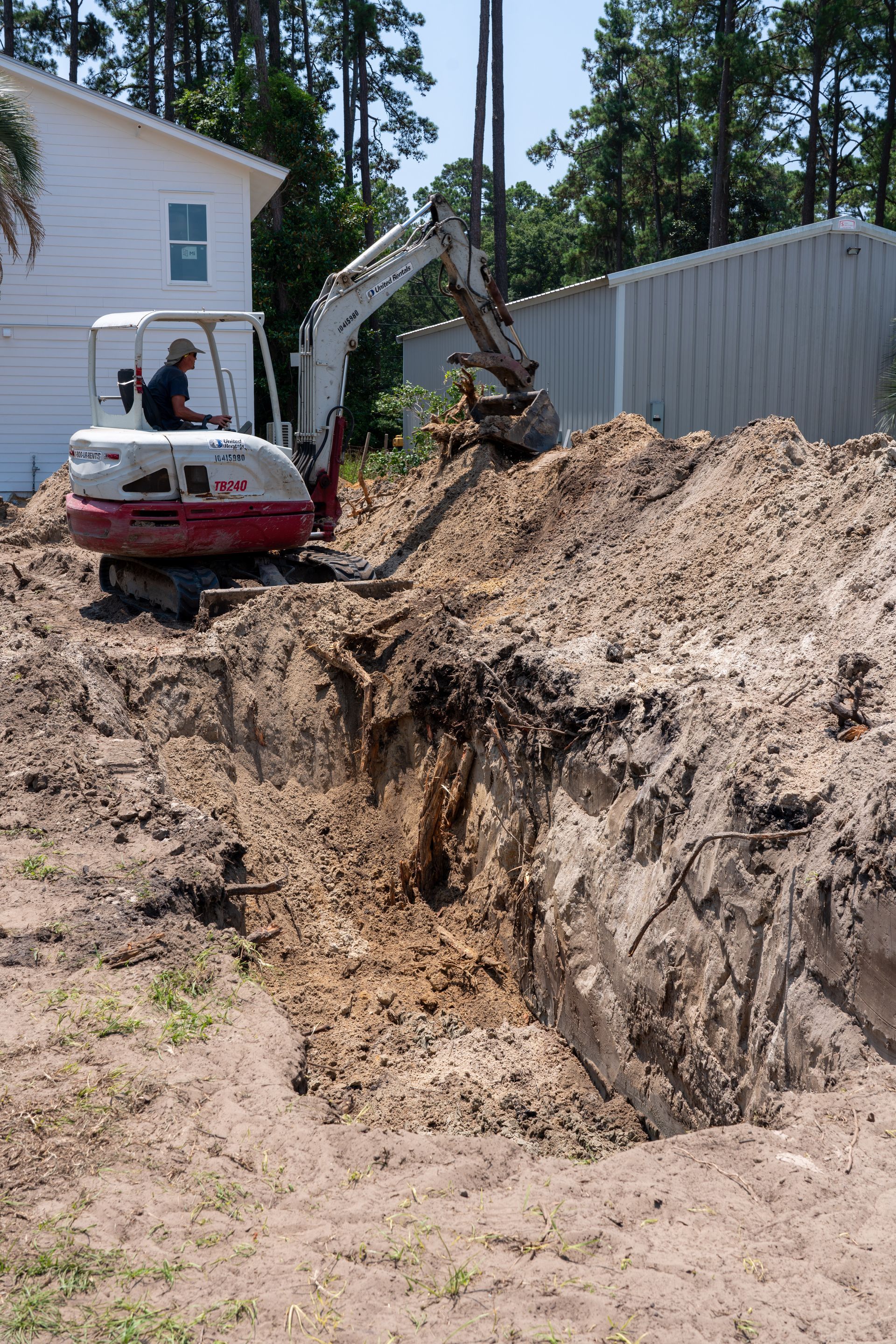 a man is driving an excavator that says tb400 on it