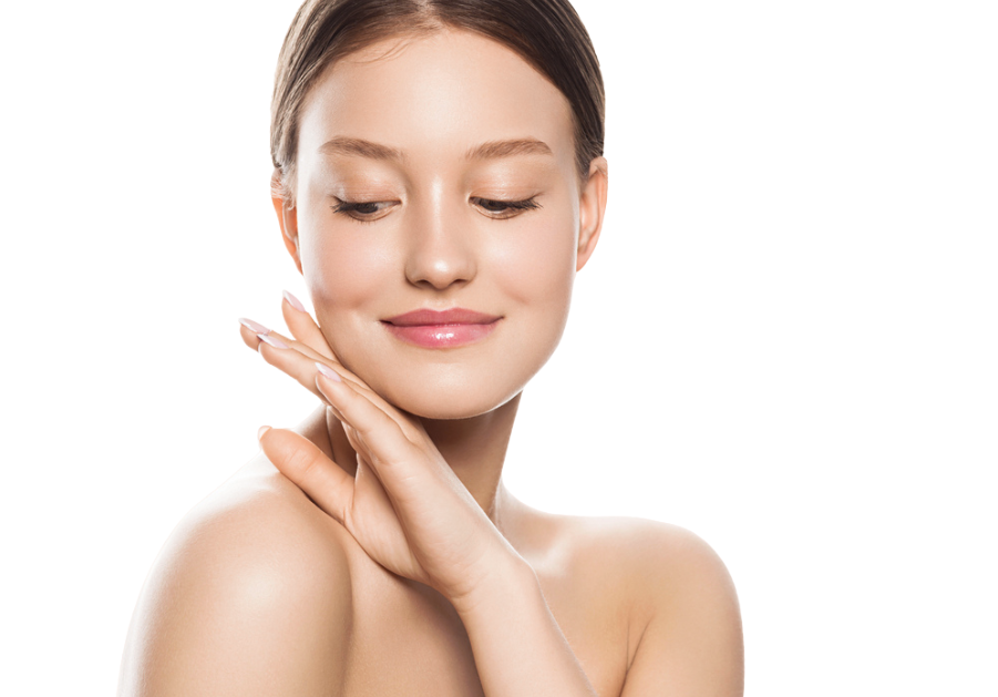 A woman is covering her face with a green leaf. — Townsville Anti Aging in Currajong, QLD