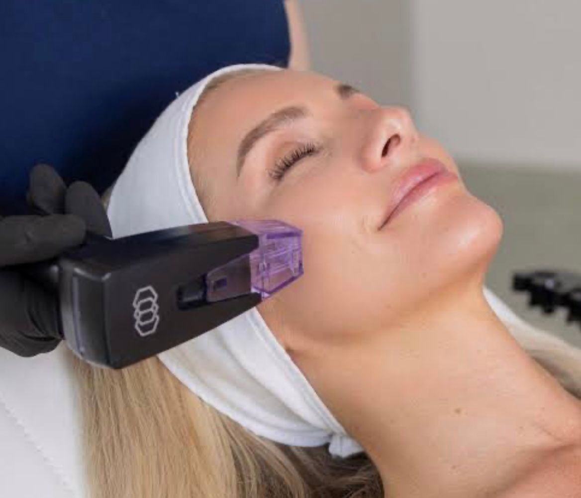 A Woman is Getting a Facial Treatment at a Spa — Townsville Anti Aging in Currajong, QLD