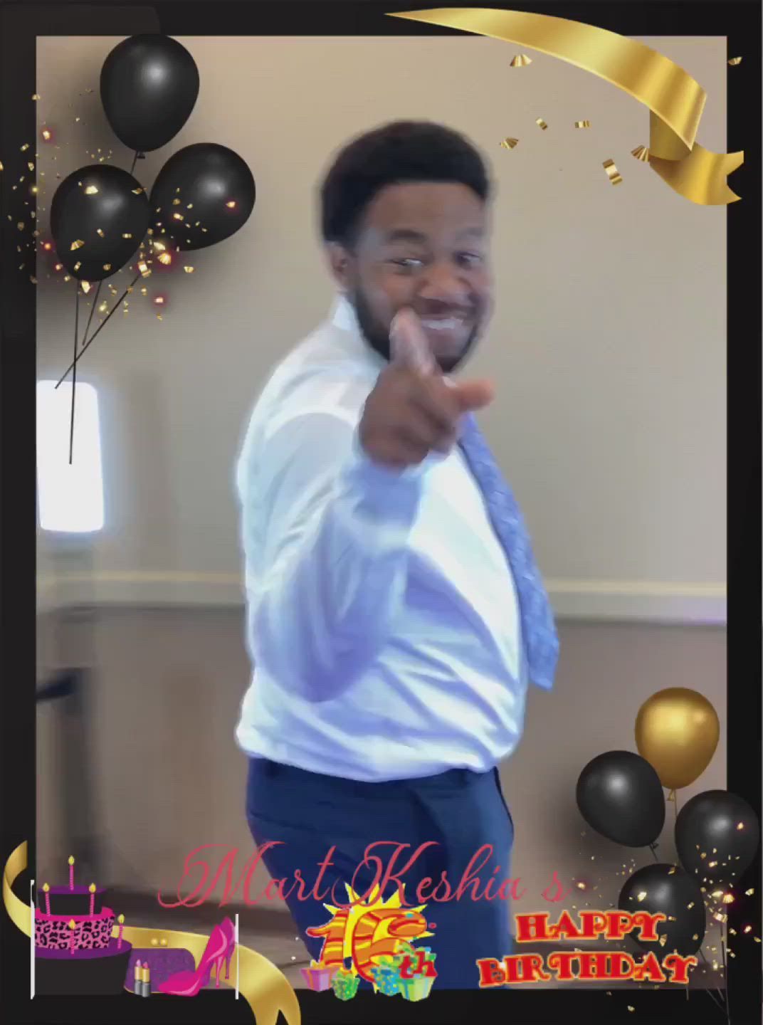 A man giving a thumbs up in front of balloons and a happy birthday sign
