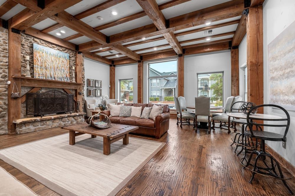 a living room filled with furniture and a fireplace at Marquis at Lantana in Flower Mound, TX.