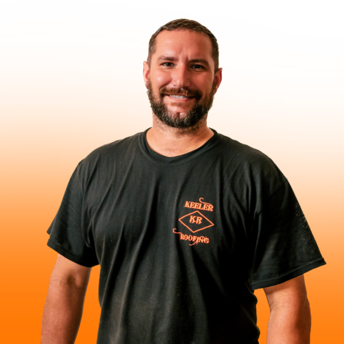 A man with a beard is wearing a black keller t-shirt