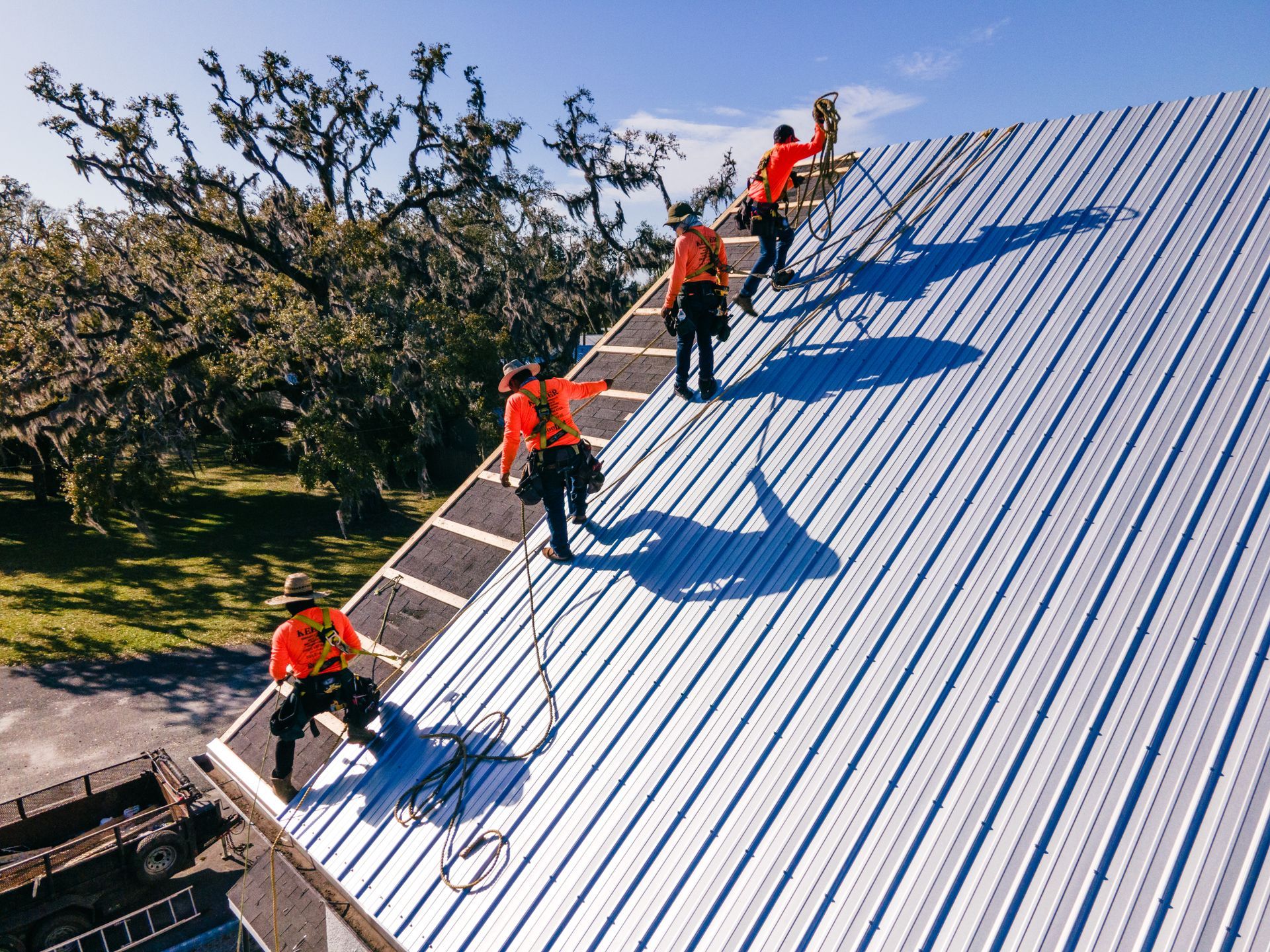 Commercial roofing contractor handling ongoing roofing system replacement.