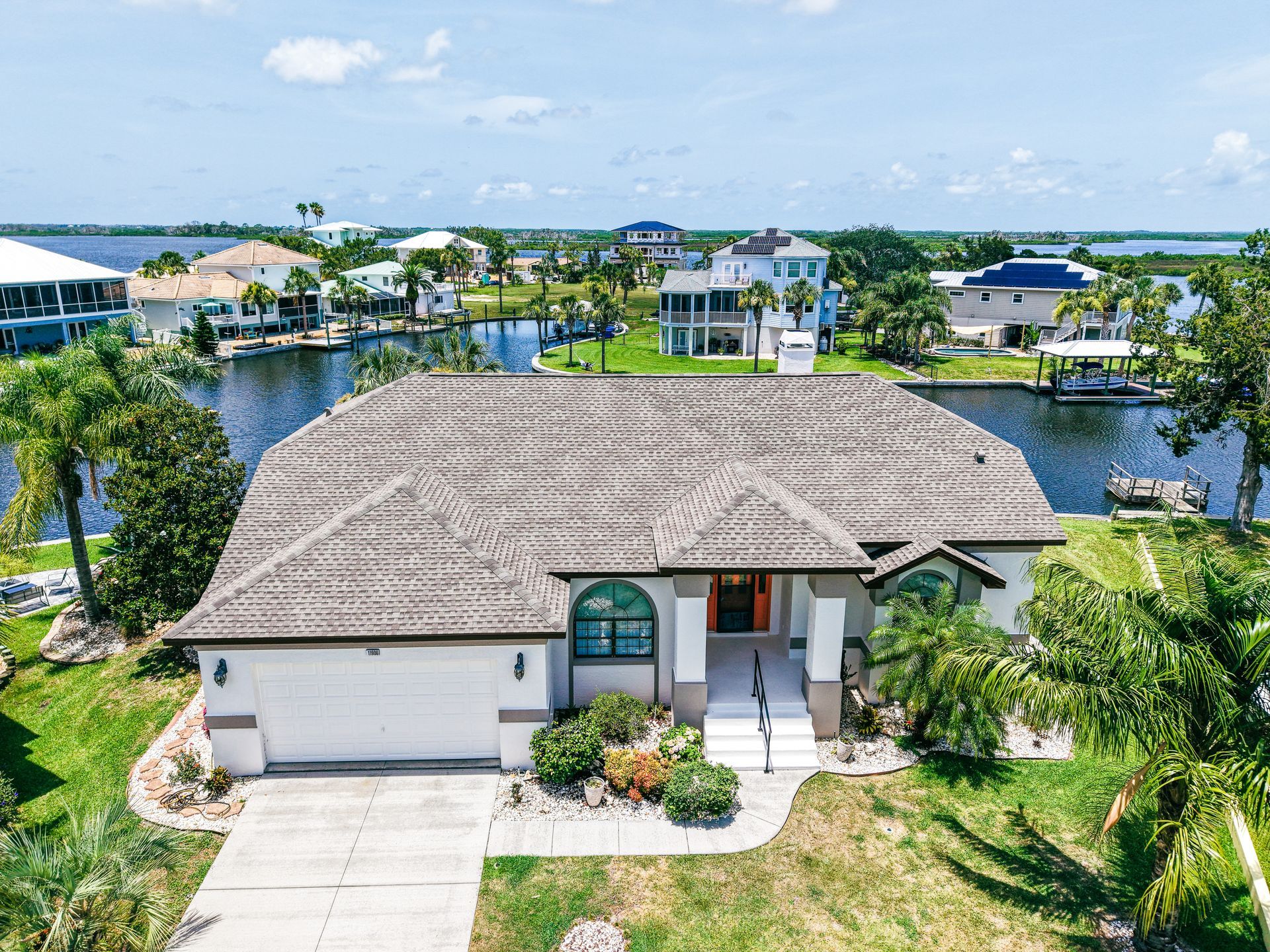 Staff explaining financing for roof repair to homeowners in Florida.