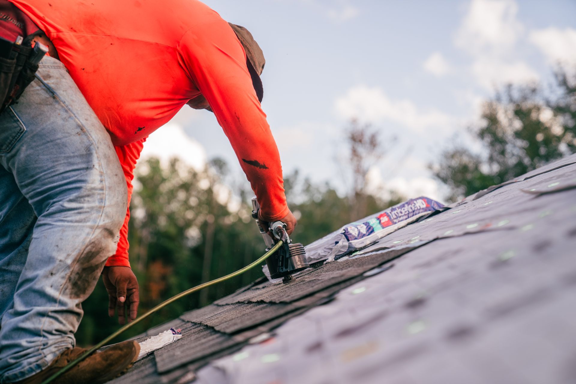 Residential roofing expert performing repairs on a home in Gainesville, FL.