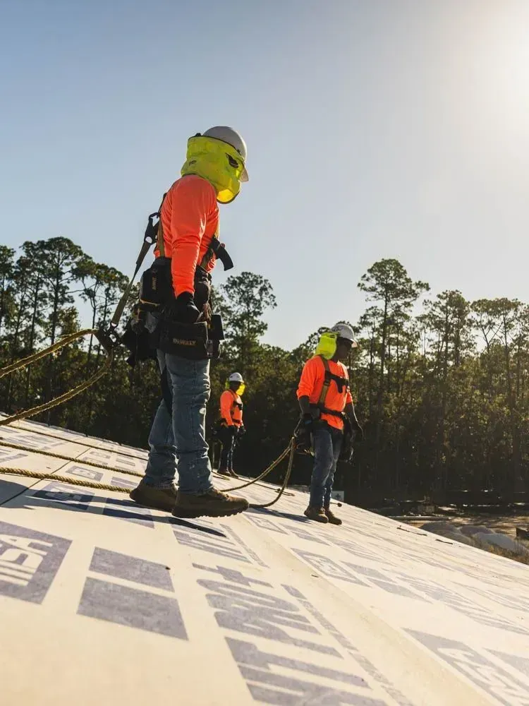 Roofing experts doing repairs and replacement in a Florida home.