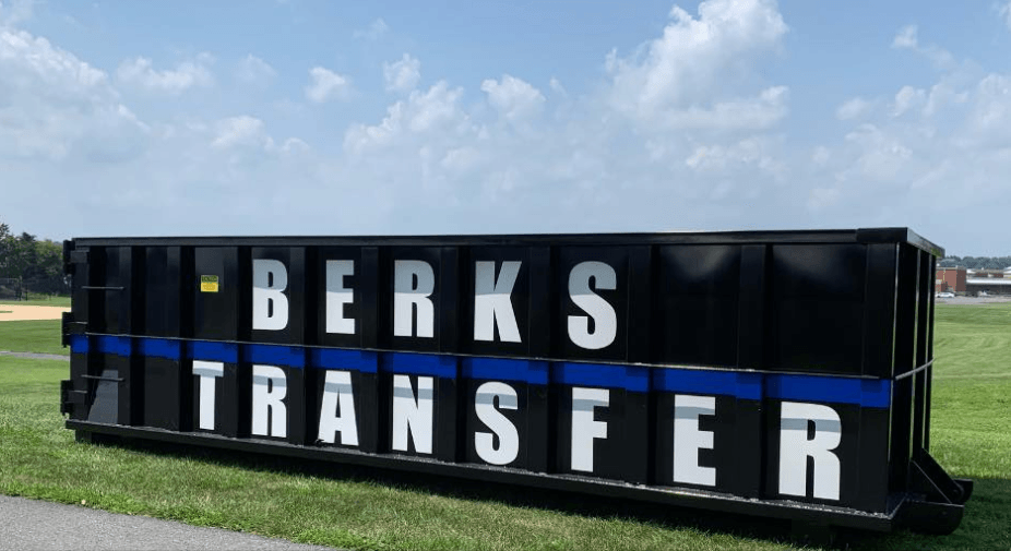 A large, black and blue Berks Transfer black dumpster at National Night Out.