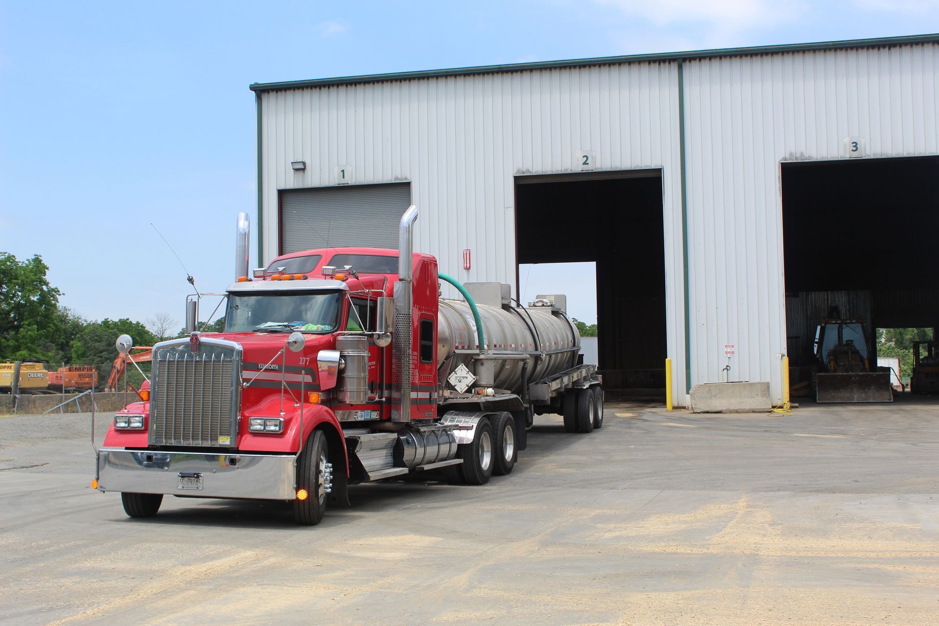 A red tanker truck has just disposed of the waste it was transporting at Berks Transfer. 