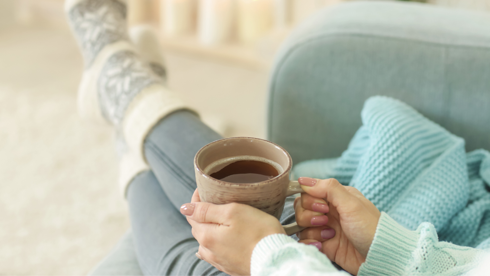 Picture of  a woman holding a mug relaxing.