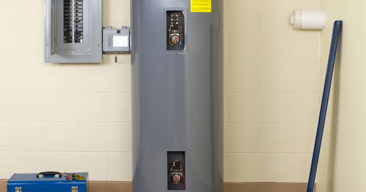 Picture of a water heater next to an electrical box.