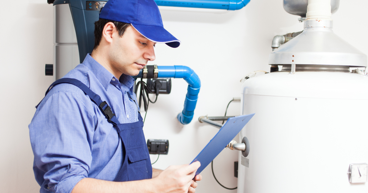 A man inspecting a water heater system