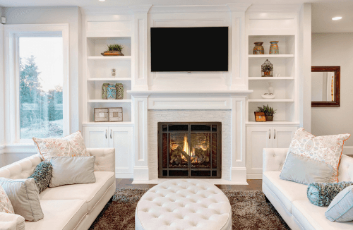 Picture of a living room with a wood fireplace.