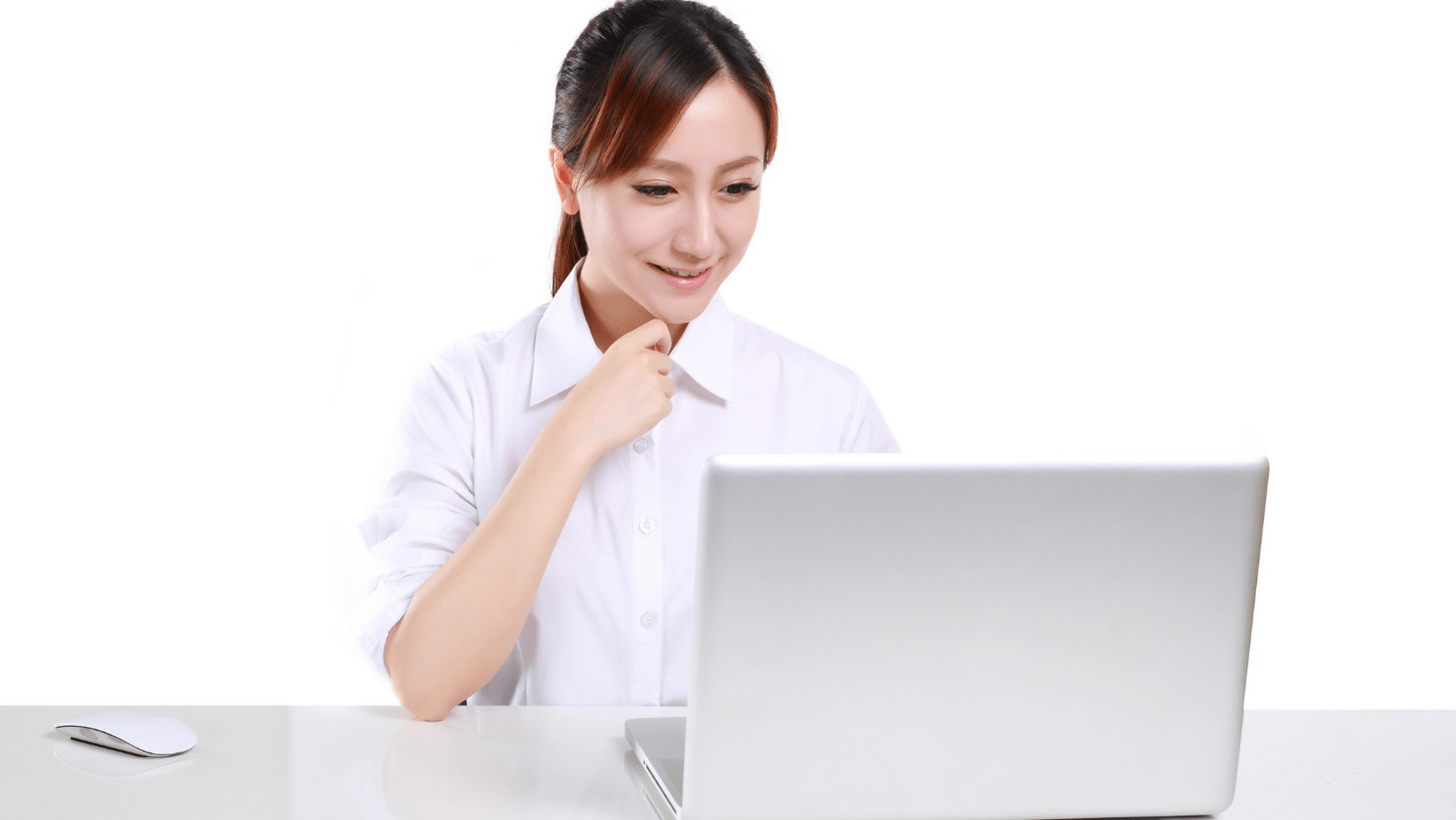 Picture of a woman sitting in front of a laptop.