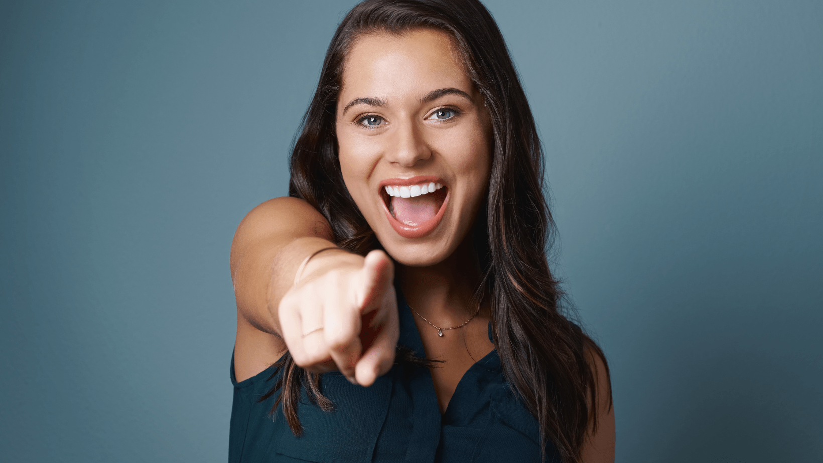 Girl pointing at the camera