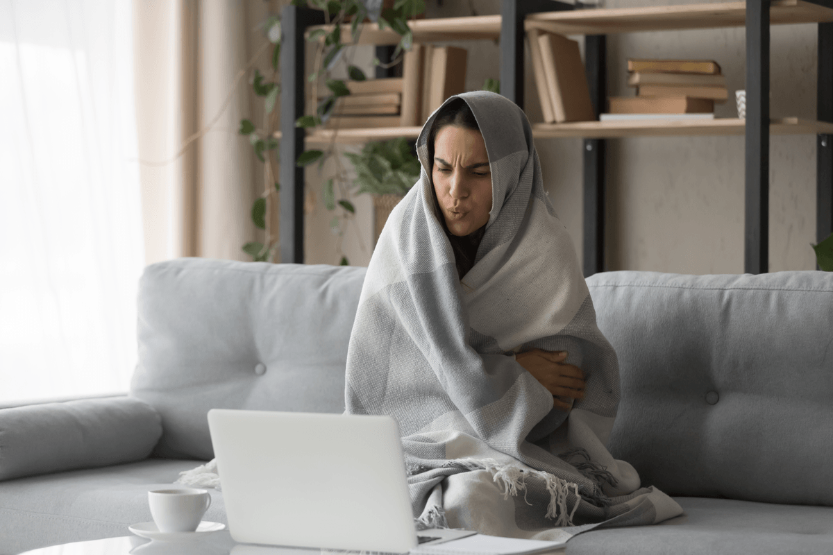 Picture of a woman bundled with a blanket.