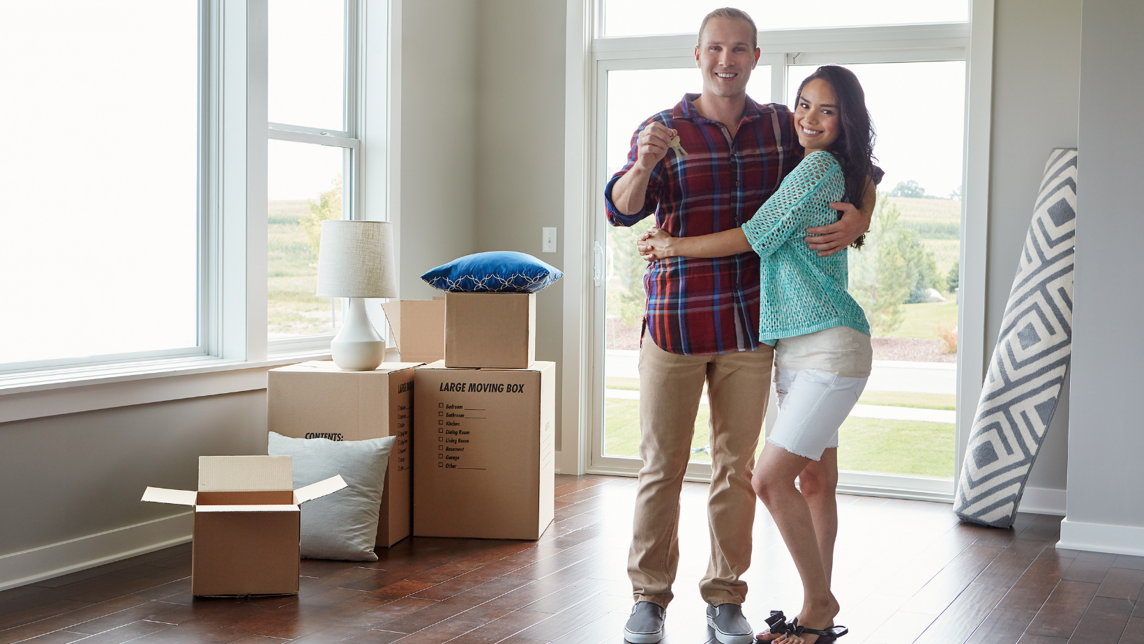 Picture of a happy couple that just moved into a new home.