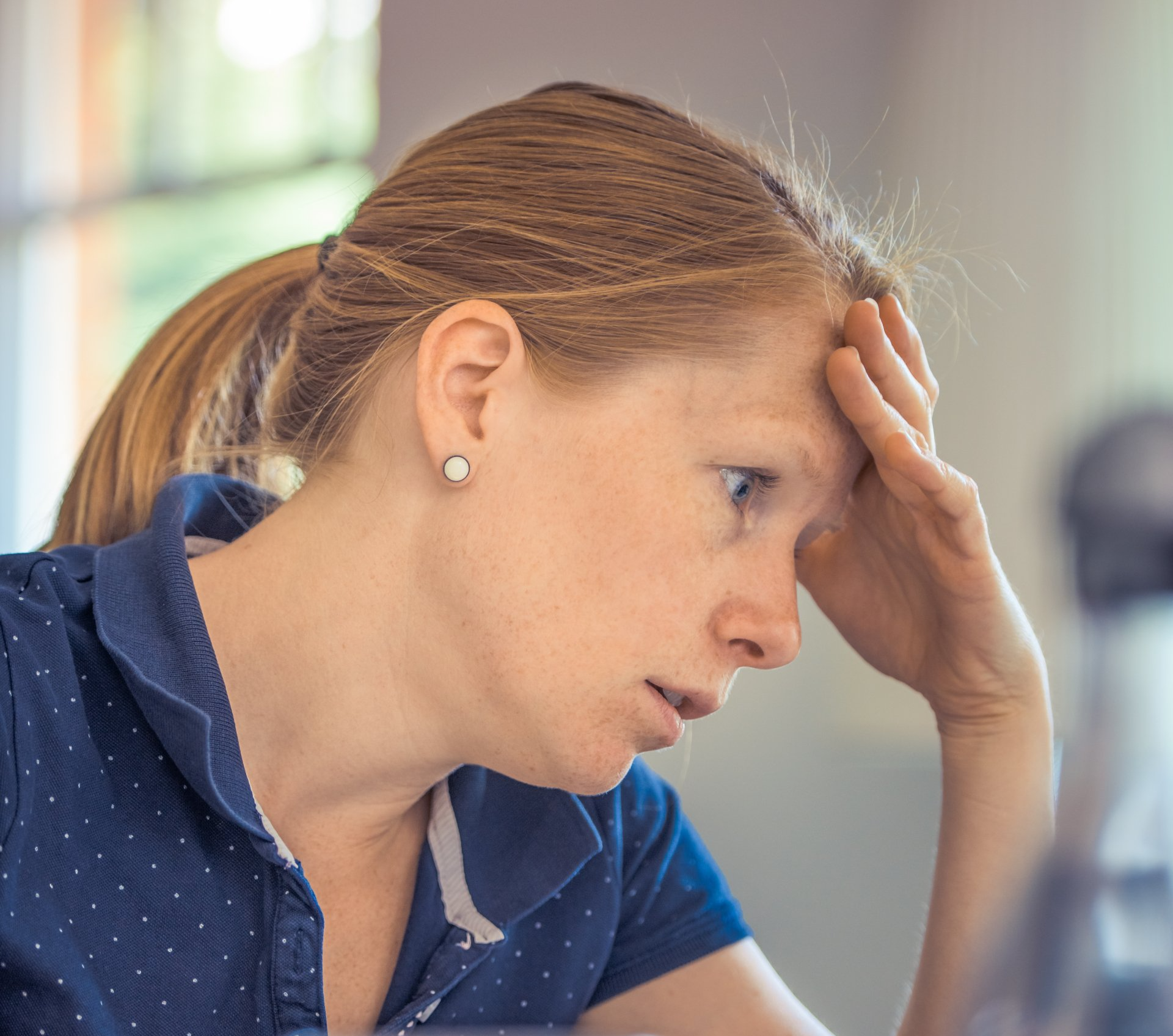 Picture of a woman looking frustrated.