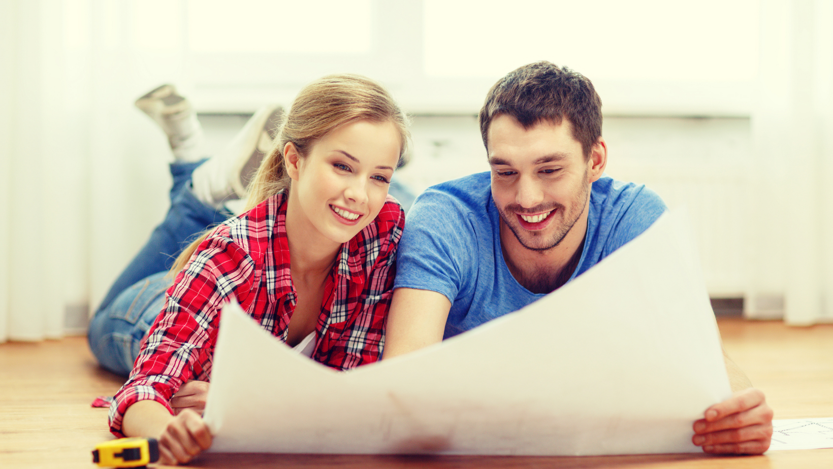 A couple looking at blueprints.