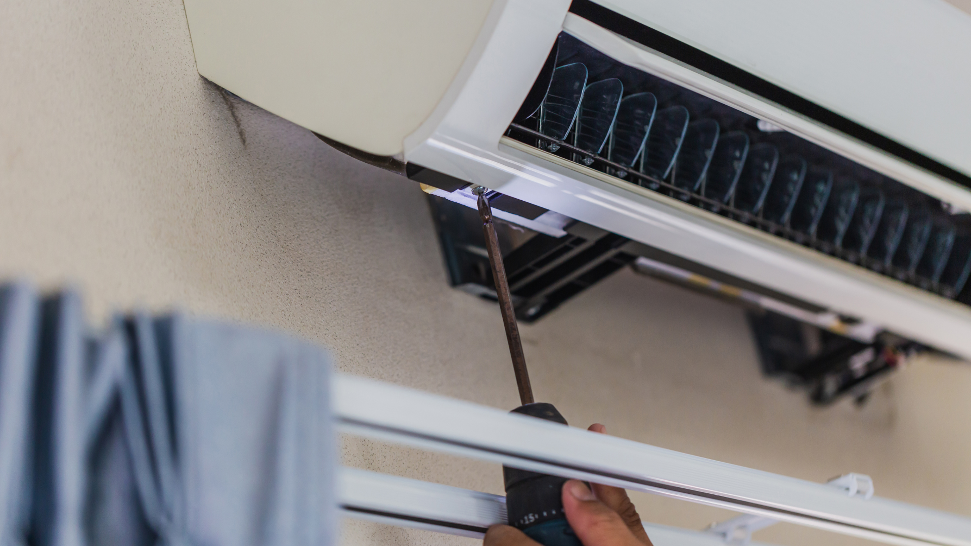 image of an air conditioner unit being repaired