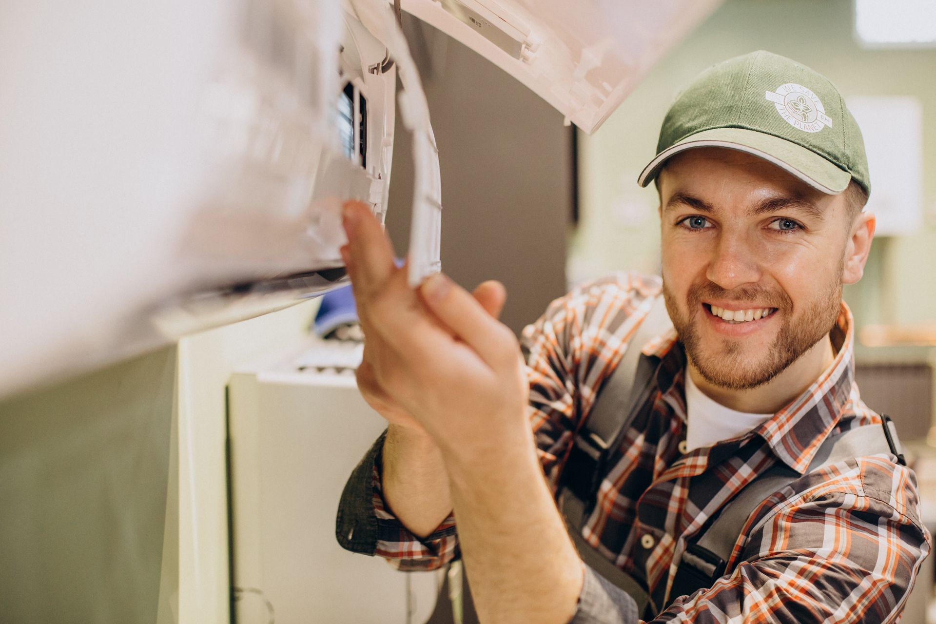 A man repairing air conditioner.