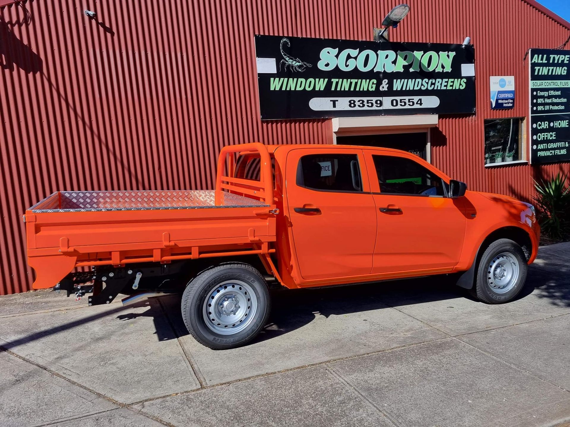 Orange Ute in Front of Business Building — Enfield, SA — Scorpion Window Tinting