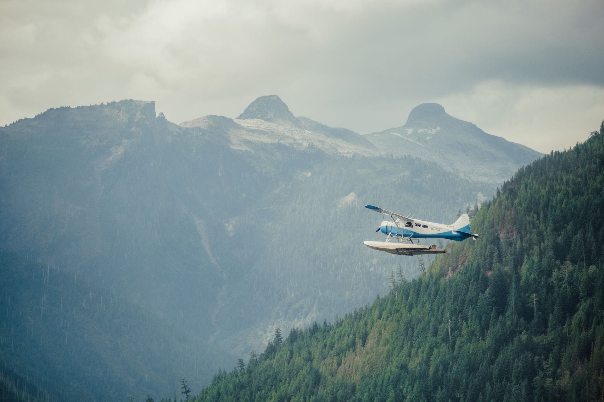 White RV parked outdoors under a dark night sky filled with stars.