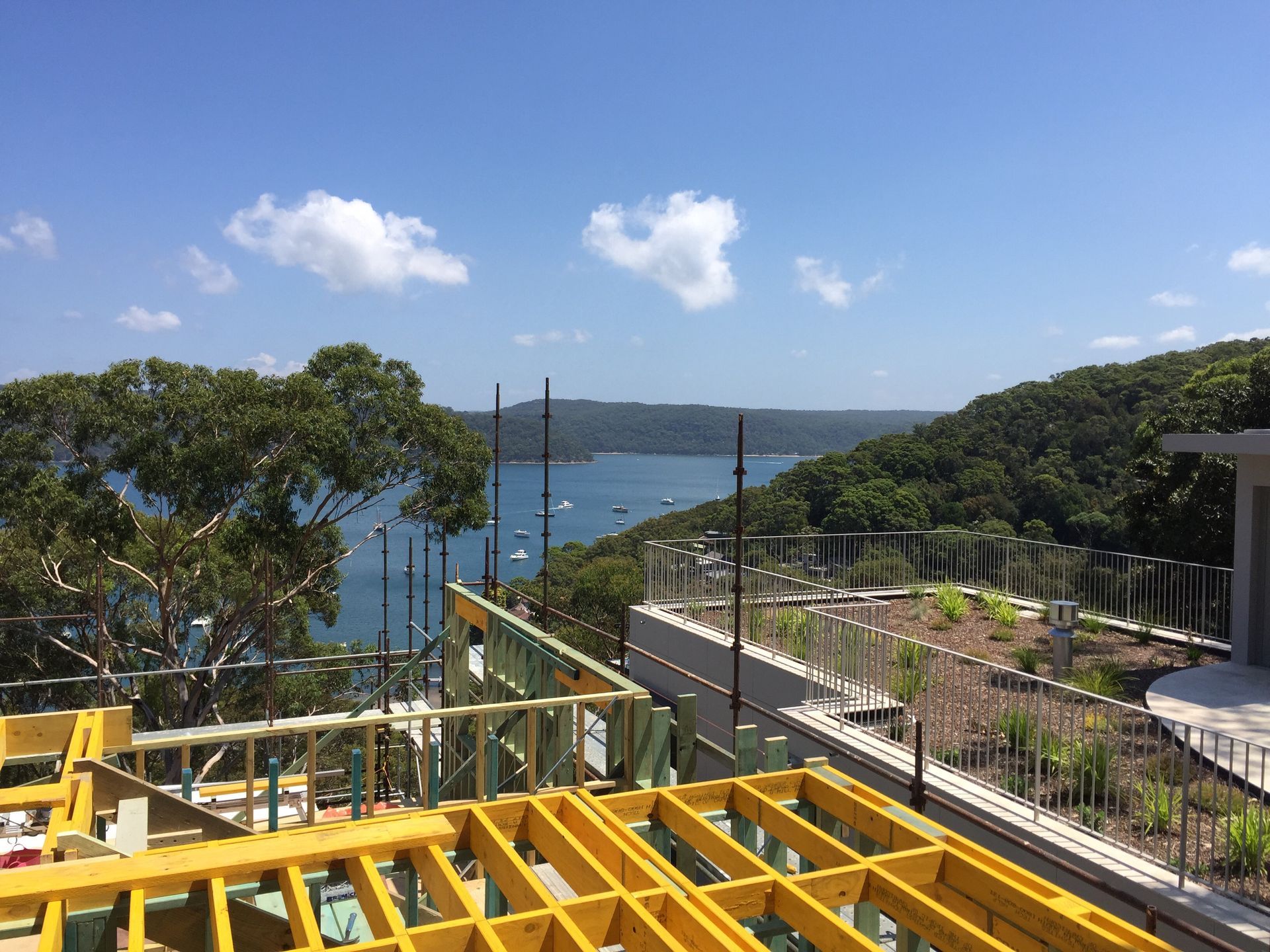 A building under construction with a view of a body of water.