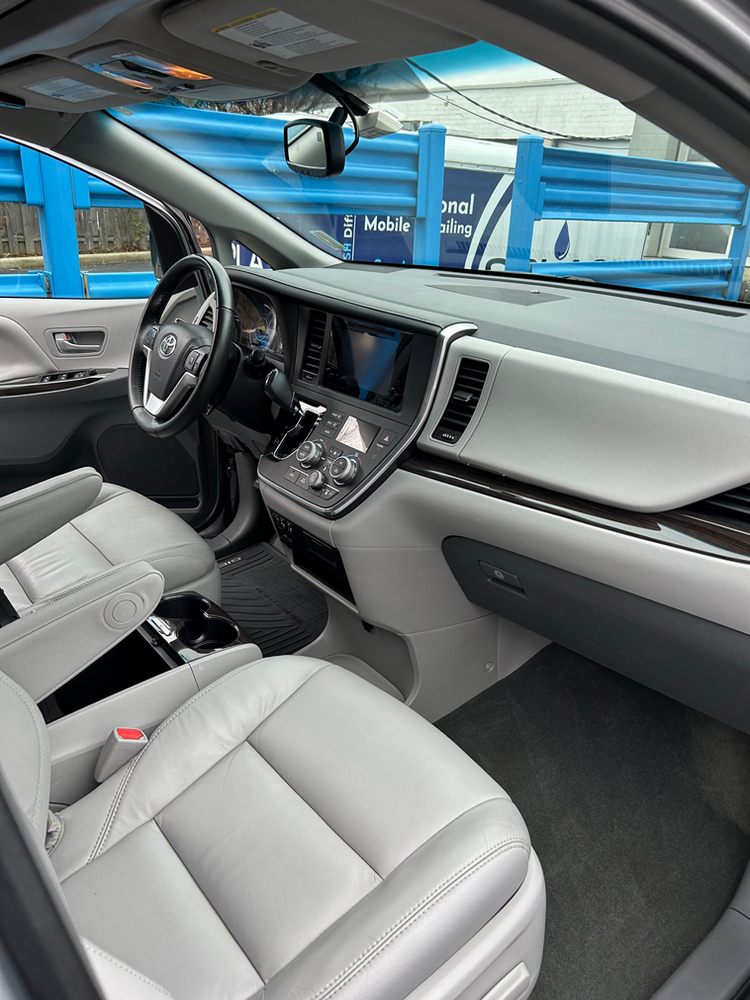 The interior of a toyota sienna minivan is shown.