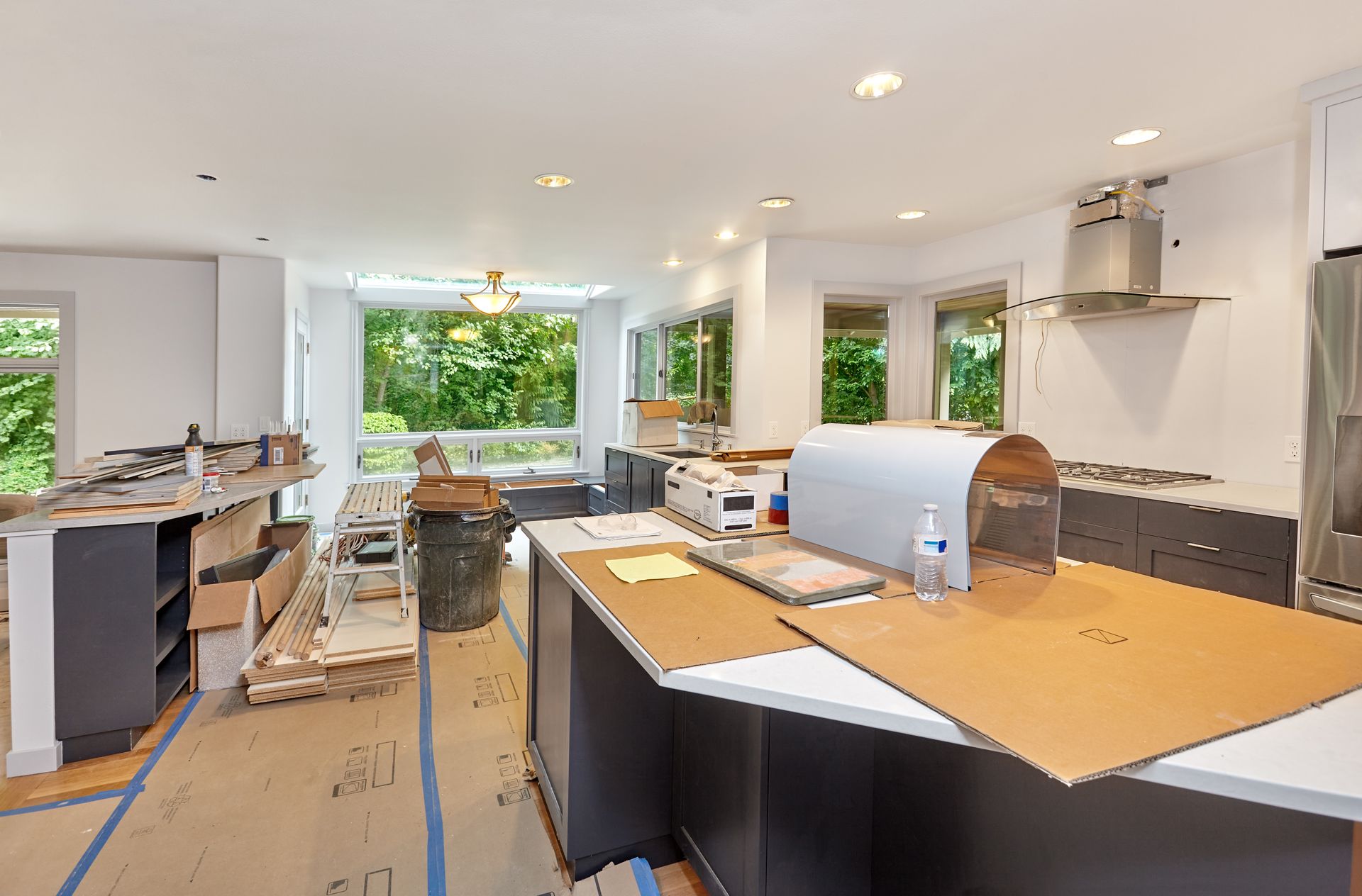 A freshly remodeled kitchen that needs some construction cleanup done.