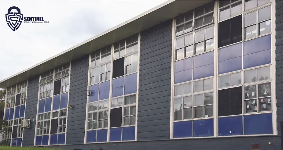 A building with a lot of windows and a logo that says sentinel