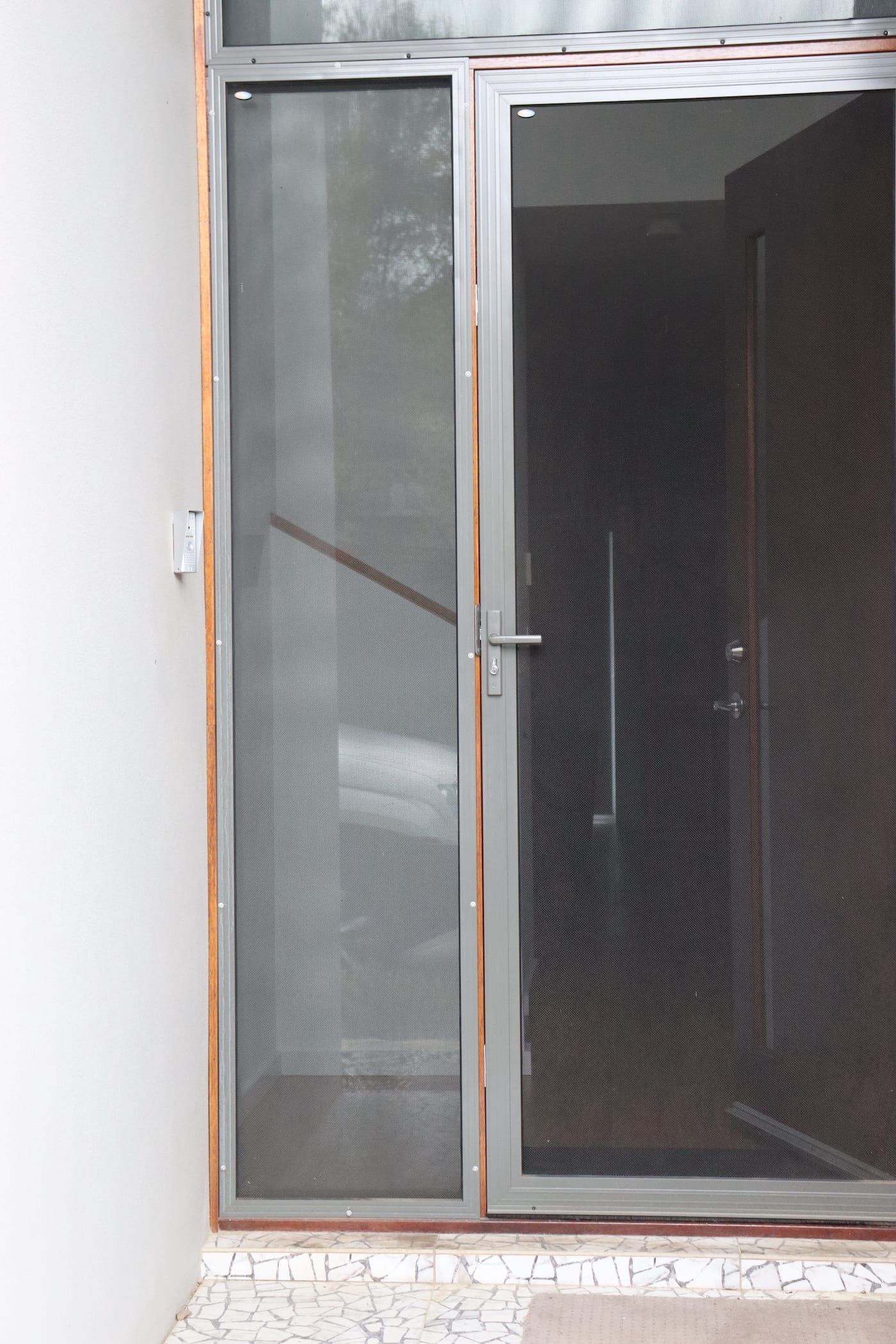 A sliding glass door with a screen on it