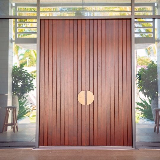 The door is made of wood and has a round handle