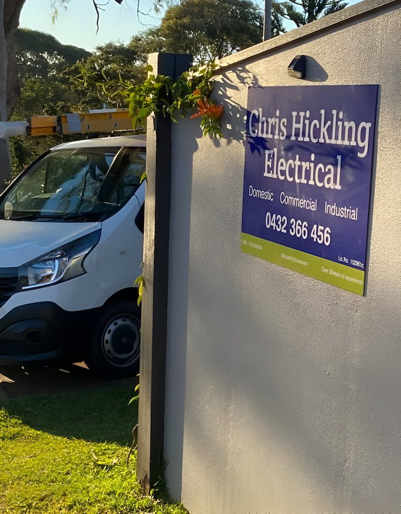 A White Van Is Parked Next To A Sign That Says Chris Hickling Electrical — Chris Hickling Electrical In Port Macquarie, NSW